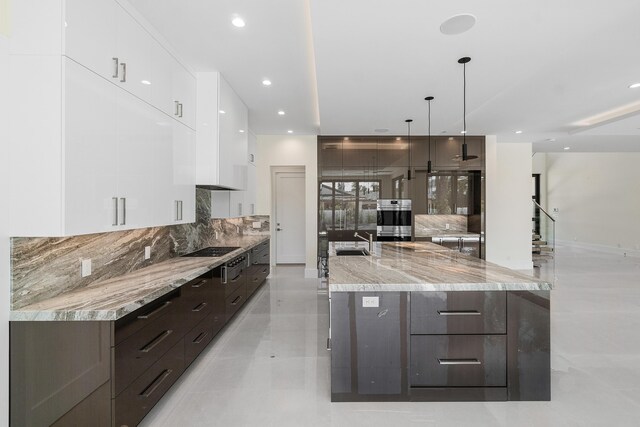 368 Churchill Rd, West Palm Beach, FL 33405 - kitchen with modern cabinets, white cabinetry, gas stovetop, dark brown cabinetry, and decorative backsplash