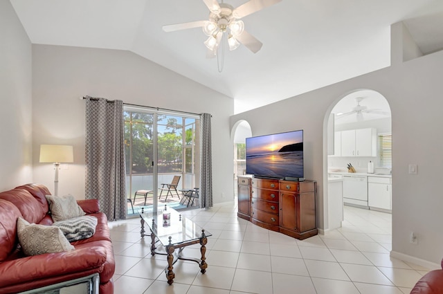 1744 Sawgrass Cir, Greenacres, FL 33413 - living room featuring a ceiling fan, light tile patterned flooring, arched walkways, and vaulted ceiling