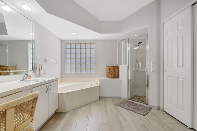 1744 Sawgrass Cir, Greenacres, FL 33413 - full bath with vanity, a bath, plenty of natural light, and a shower stall