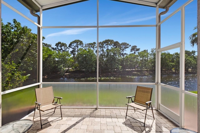 1744 Sawgrass Cir, Greenacres, FL 33413 - unfurnished sunroom with a water view