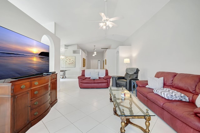 1744 Sawgrass Cir, Greenacres, FL 33413 - living room featuring vaulted ceiling, arched walkways, ceiling fan, and light tile patterned floors