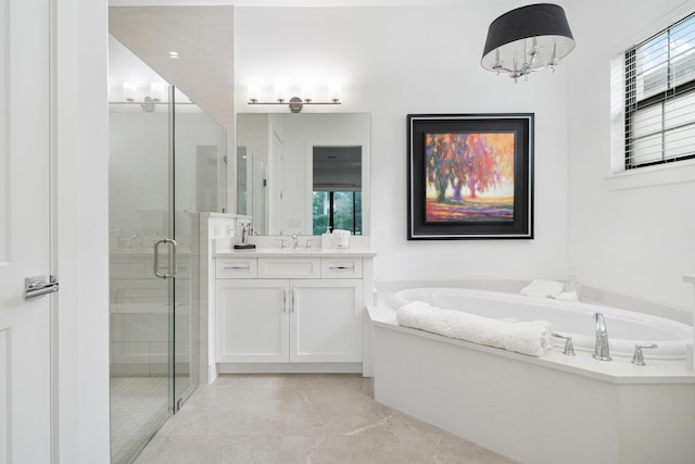bathroom featuring an inviting chandelier, a stall shower, vanity, and a bath