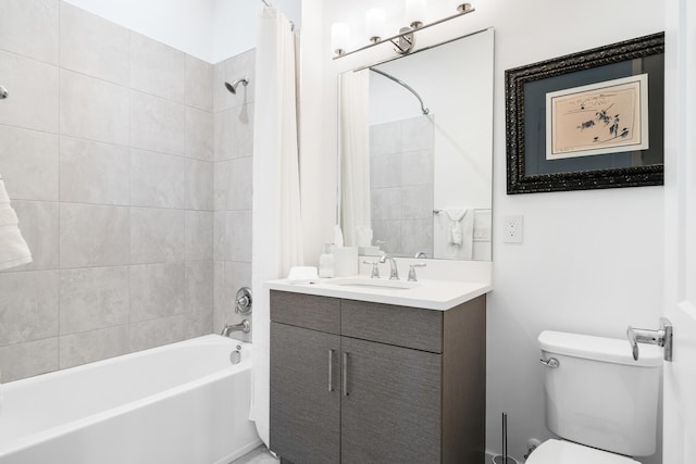 bathroom with vanity, toilet, and shower / tub combo
