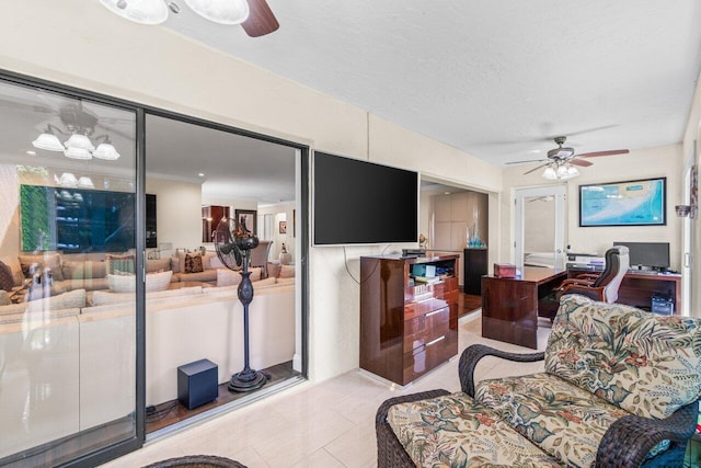 9 Stratford Dr Unit D, Boynton Beach, FL 33436 - living room with a textured ceiling, light tile patterned floors, and ceiling fan
