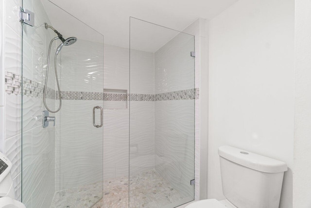 9 Stratford Dr Unit D, Boynton Beach, FL 33436 - bathroom featuring toilet and a stall shower