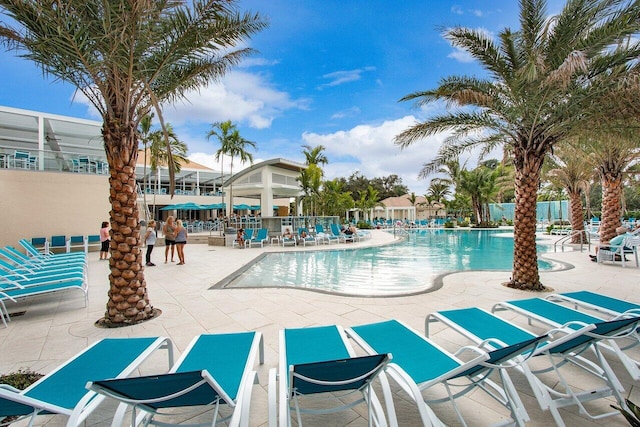 9 Stratford Dr Unit D, Boynton Beach, FL 33436 - community pool with a patio area and fence