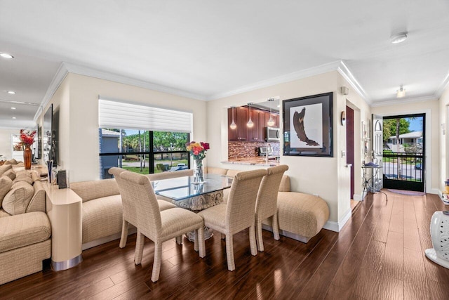 9 Stratford Dr Unit D, Boynton Beach, FL 33436 - dining room featuring dark wood finished floors, crown molding, recessed lighting, and baseboards