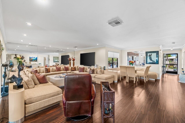 9 Stratford Dr Unit D, Boynton Beach, FL 33436 - living room featuring crown molding, dark wood-style floors, visible vents, and a wealth of natural light