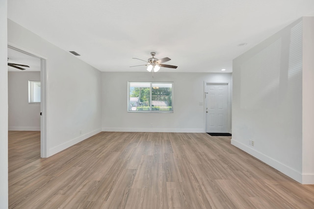 12938 Ellison Wilson Rd, North Palm Beach, FL 33408 - spare room with a ceiling fan, light wood finished floors, and baseboards