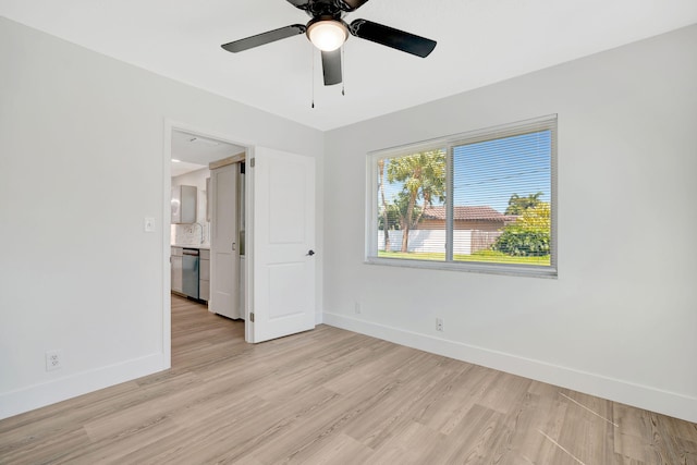 12938 Ellison Wilson Rd, North Palm Beach, FL 33408 - empty room featuring baseboards, light wood-type flooring, and ceiling fan