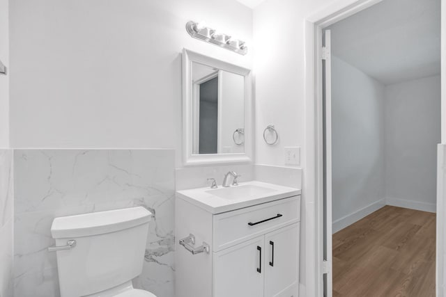 12938 Ellison Wilson Rd, North Palm Beach, FL 33408 - bathroom featuring vanity, toilet, and wood finished floors