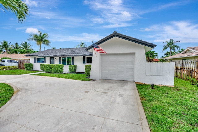 12938 Ellison Wilson Rd, North Palm Beach, FL 33408 - single story home with a tile roof, concrete driveway, stucco siding, and an attached garage