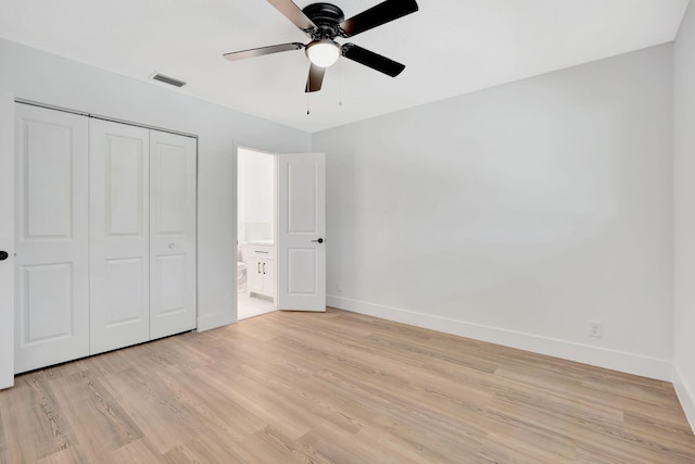 12938 Ellison Wilson Rd, North Palm Beach, FL 33408 - unfurnished bedroom featuring baseboards, light wood-style floors, a closet, and ceiling fan