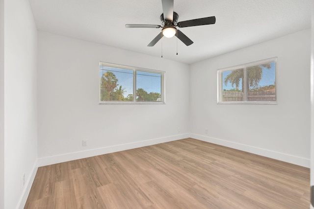 12938 Ellison Wilson Rd, North Palm Beach, FL 33408 - empty room featuring healthy amount of natural light, baseboards, light wood-type flooring, and a ceiling fan