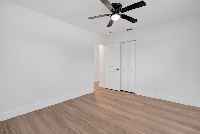 12938 Ellison Wilson Rd, North Palm Beach, FL 33408 - spare room featuring baseboards, light wood-style floors, and a ceiling fan