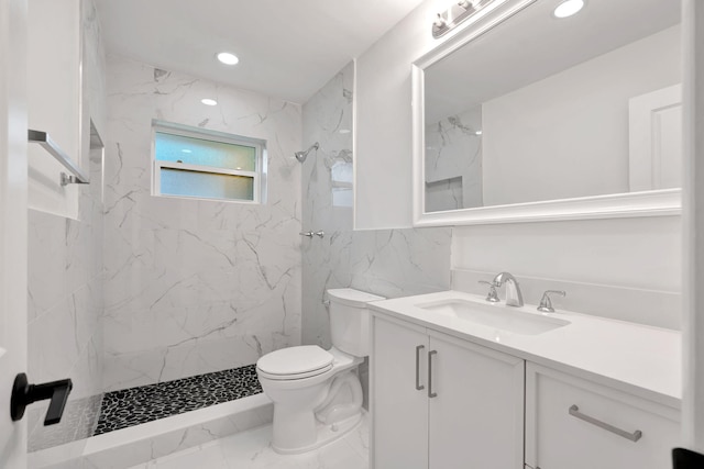 12938 Ellison Wilson Rd, North Palm Beach, FL 33408 - bathroom featuring marble finish flooring, toilet, vanity, a marble finish shower, and tile walls