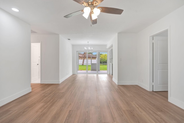 12938 Ellison Wilson Rd, North Palm Beach, FL 33408 - unfurnished living room with a chandelier, baseboards, ceiling fan, light wood-style floors, and recessed lighting