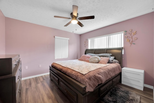 332 Smallwood Ave, Fort Pierce, FL 34982 - bedroom with ceiling fan, dark wood-style floors, baseboards, and a textured ceiling