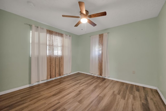 332 Smallwood Ave, Fort Pierce, FL 34982 - unfurnished room with baseboards, a ceiling fan, and wood finished floors
