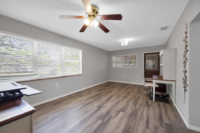 332 Smallwood Ave, Fort Pierce, FL 34982 - unfurnished office with visible vents, a ceiling fan, a textured ceiling, wood finished floors, and baseboards