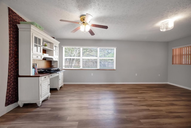 332 Smallwood Ave, Fort Pierce, FL 34982 - unfurnished office featuring built in desk, a textured ceiling, ceiling fan, and wood finished floors