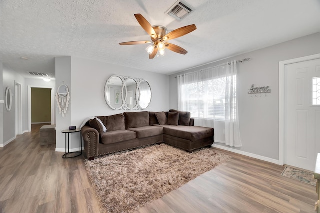 332 Smallwood Ave, Fort Pierce, FL 34982 - living room featuring wood finished floors, a ceiling fan, visible vents, and a textured ceiling