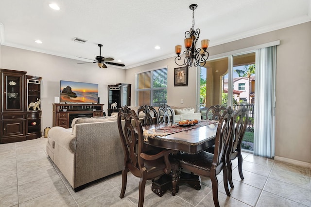 dining area with crown molding, light tile patterned flooring, ceiling fan with notable chandelier, and visible vents