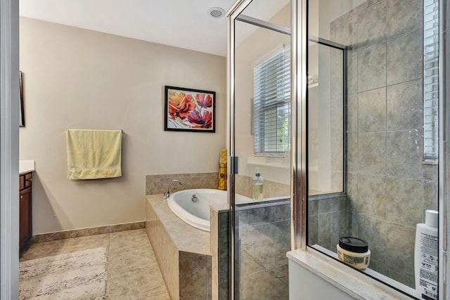bathroom with tile patterned flooring, baseboards, tiled shower, a bath, and vanity