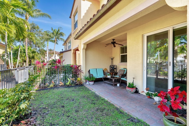 view of yard with a patio, ceiling fan, and fence