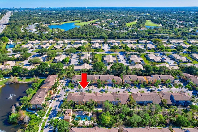 aerial view featuring a residential view and a water view