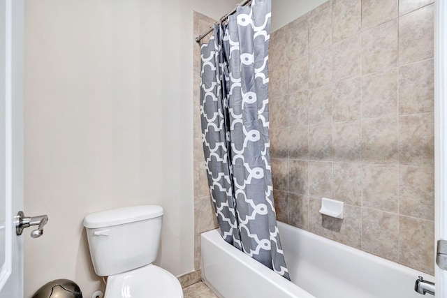 bathroom with toilet and shower / tub combo