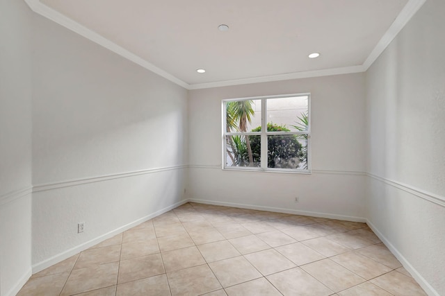 empty room featuring baseboards, ornamental molding, and recessed lighting