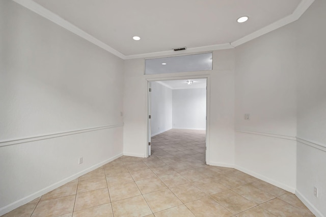 empty room featuring light tile patterned flooring, ornamental molding, visible vents, and recessed lighting