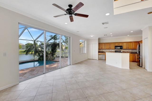 unfurnished living room with light tile patterned floors, visible vents, ornamental molding, and ceiling fan
