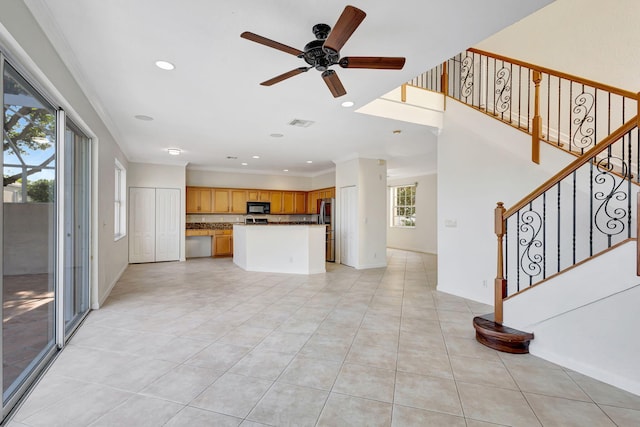 unfurnished living room with light tile patterned floors, ceiling fan, recessed lighting, and stairs