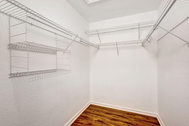 spacious closet with wood finished floors