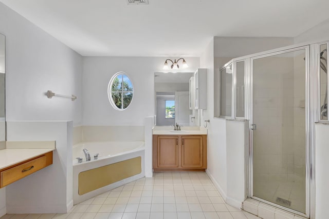 bathroom featuring vanity, tile patterned flooring, a shower stall, a bath, and visible vents