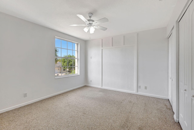 unfurnished bedroom with light colored carpet and baseboards