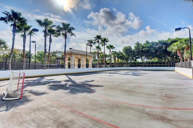 exterior space featuring fence and uncovered parking