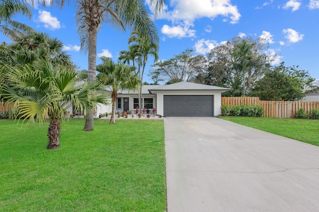 280 Sulky Way, Wellington, FL 33414 - ranch-style home featuring fence, stucco siding, concrete driveway, a front lawn, and a garage