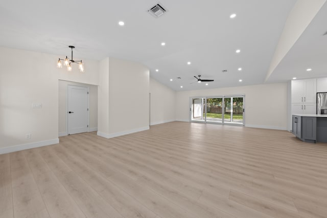 280 Sulky Way, Wellington, FL 33414 - unfurnished living room with visible vents, baseboards, light wood-type flooring, and lofted ceiling