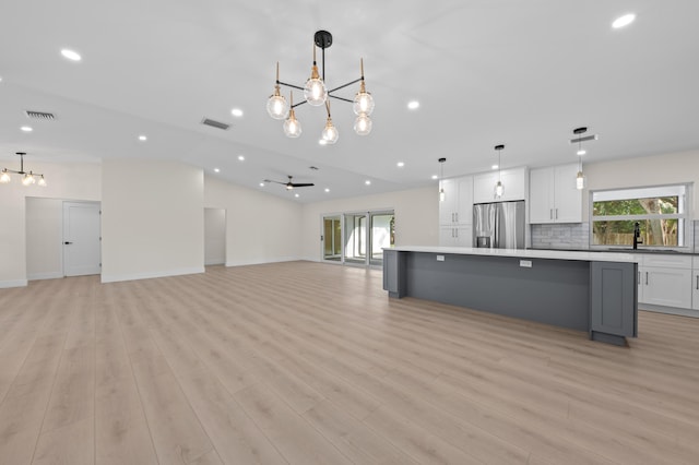 280 Sulky Way, Wellington, FL 33414 - kitchen featuring white cabinetry, open floor plan, stainless steel fridge with ice dispenser, and visible vents