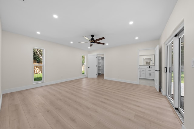 280 Sulky Way, Wellington, FL 33414 - unfurnished living room with recessed lighting, baseboards, and light wood finished floors