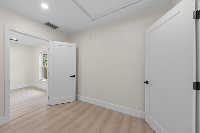 280 Sulky Way, Wellington, FL 33414 - empty room with light wood-type flooring, visible vents, baseboards, and attic access