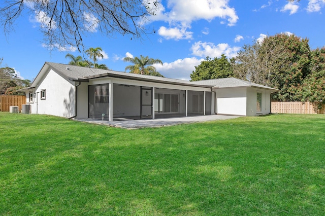 280 Sulky Way, Wellington, FL 33414 - back of house with stucco siding, fence, a yard, and a sunroom