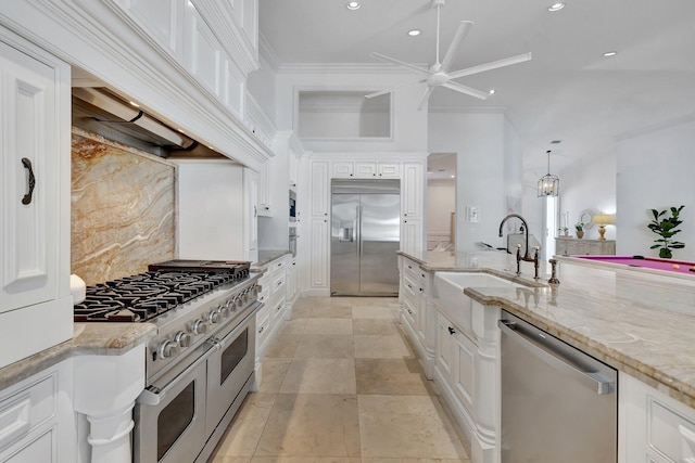 15082 Tall Oak Ave, Delray Beach, FL 33446 - kitchen featuring white cabinets, a ceiling fan, a sink, custom range hood, and high quality appliances