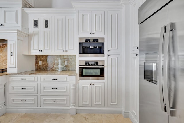 15082 Tall Oak Ave, Delray Beach, FL 33446 - kitchen with white cabinets, stainless steel appliances, light stone countertops, and tasteful backsplash