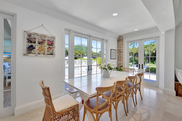 15082 Tall Oak Ave, Delray Beach, FL 33446 - dining room featuring french doors, crown molding, baseboards, and a wealth of natural light