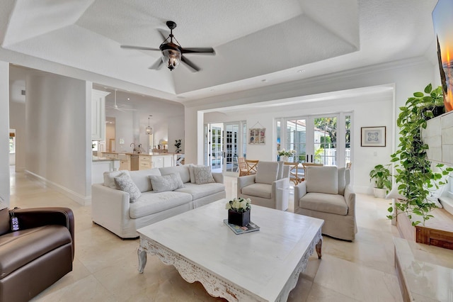 15082 Tall Oak Ave, Delray Beach, FL 33446 - living area with a tray ceiling, ornamental molding, baseboards, a textured ceiling, and ceiling fan