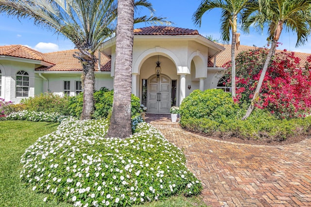 15082 Tall Oak Ave, Delray Beach, FL 33446 - view of front of home featuring stucco siding and a tiled roof